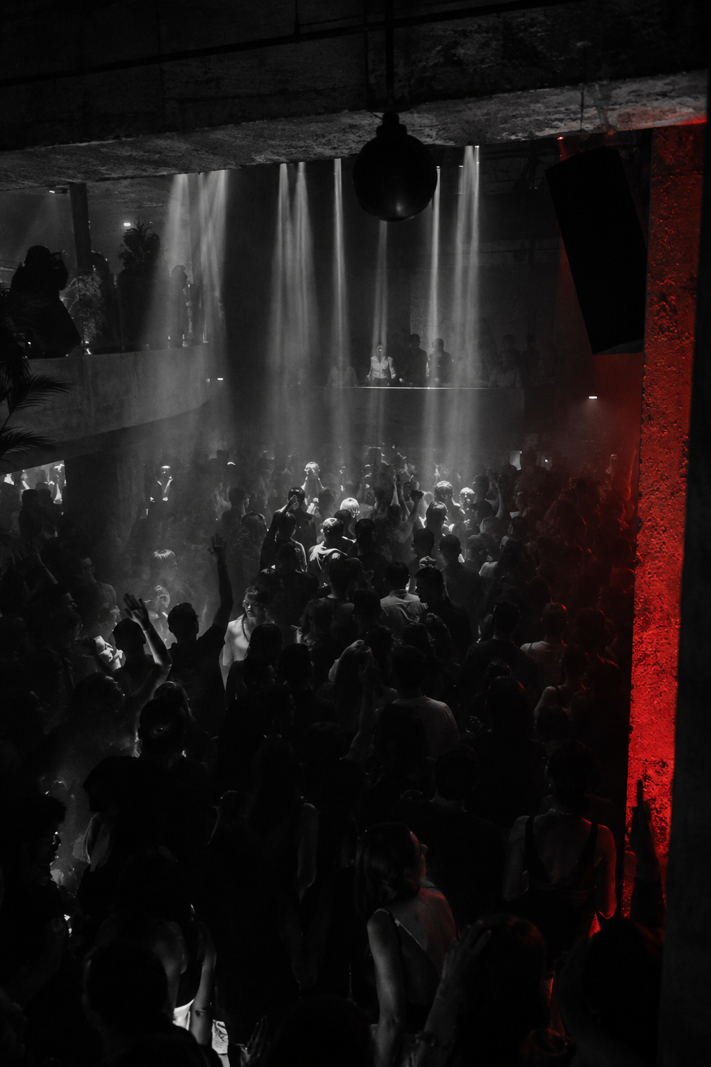 ZONA dance floor under white beams and red light