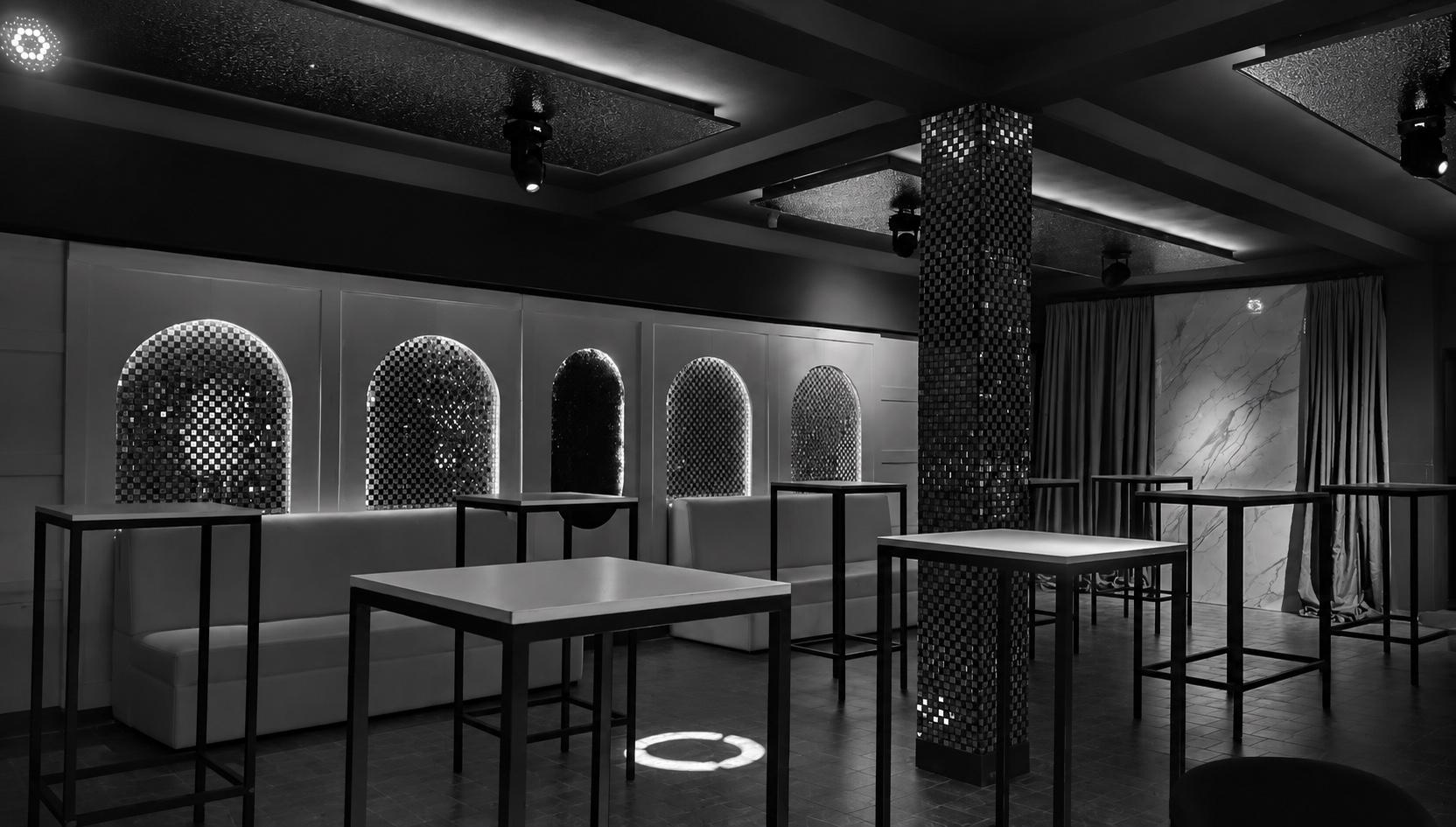 ZONA private club interior with tables and booths
